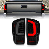 Thumbnail for ANZO 16-21 Toyota Tacoma LED Tail Lights - w/ Light Bar Sequential Black Housing & Smoke Lens