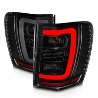 Thumbnail for ANZO 1999-2004 Jeep Grand Cherokee LED Tail Lights w/ Light Bar Black Housing Smoke Lens
