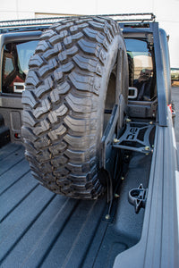 Thumbnail for DV8 Offroad 2019+ Jeep Gladiator Universal Stand Up In-Bed Tire Carrier