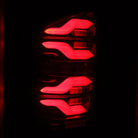 Thumbnail for AlphaRex 16-21 Toyota Tacoma LUXX LED Taillights Blk/Red w/Activ Light/Seq Signal