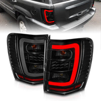 Thumbnail for ANZO 1999-2004 Jeep Grand Cherokee LED Tail Lights w/ Light Bar Black Housing Smoke Lens