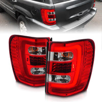 Thumbnail for ANZO 1999-2004 Jeep Grand Cherokee LED Tail Lights w/ Light Bar Chrome Housing Red/Clear Lens