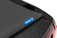 Thumbnail for Lund 04-15 Nissan Titan (6.7ft. Bed) Hard Fold Tonneau Cover - Black