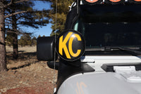 Thumbnail for KC HiLiTES 6in. Round Soft Cover (Pair) - Black w/Yellow KC Logo