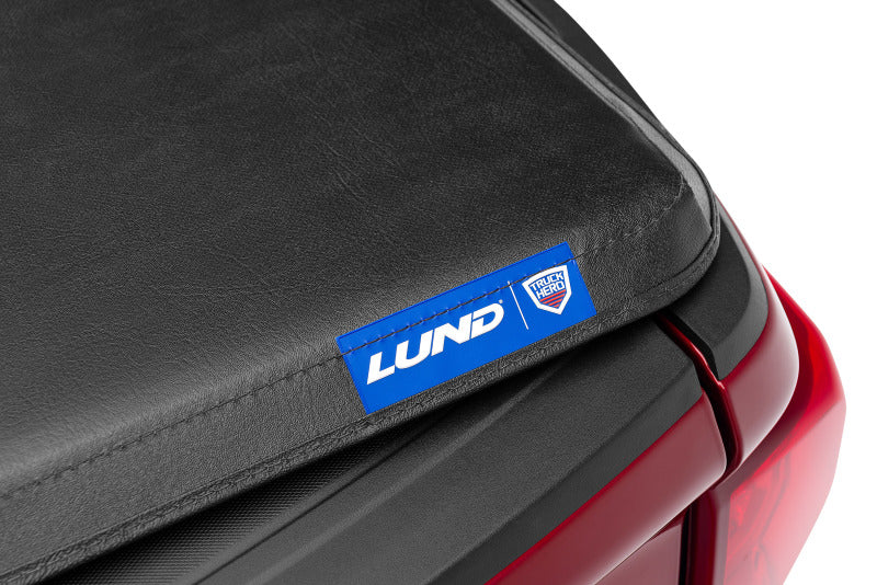 Lund 05-10 Dodge Dakota Fleetside (5.3ft. Bed) Hard Fold Tonneau Cover - Black