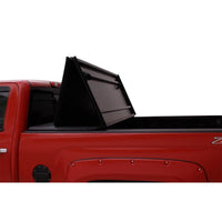 Thumbnail for Lund 16-23 Toyota Tacoma (5ft. Bed) Hard Fold Tonneau Cover - Black