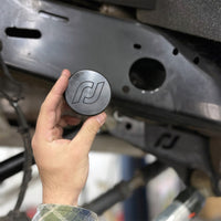 Thumbnail for RockJock JL/JT Frame Rail Plugs Frame Behind Front Axle Centerline CNC Machined Black Delrin