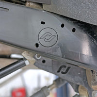Thumbnail for RockJock JL/JT Frame Rail Plugs Frame Behind Front Axle Centerline CNC Machined Black Delrin